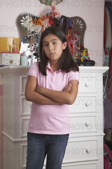 Hispanic girl with arms crossed