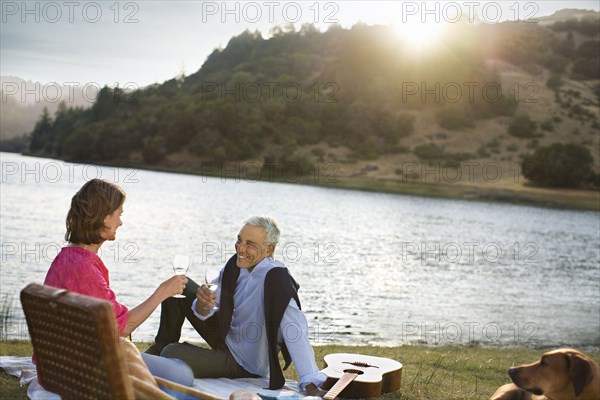 Couple enjoying wine at waterfront