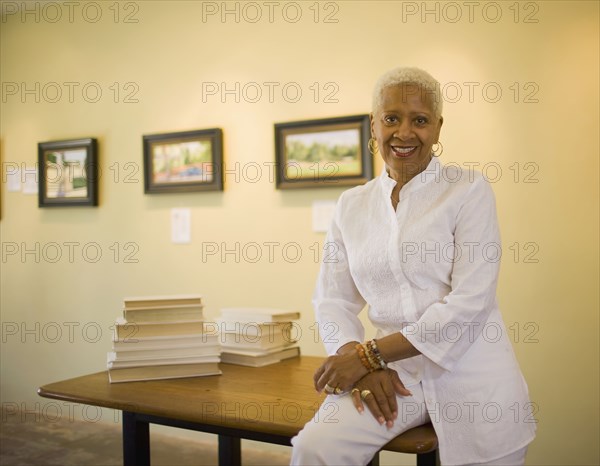 Black woman sitting on table