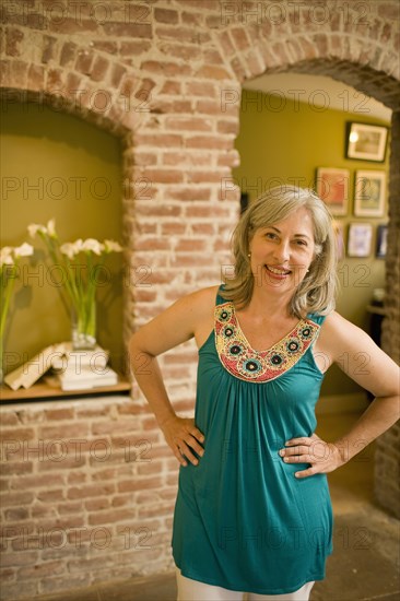 Caucasian woman standing with hands on hips