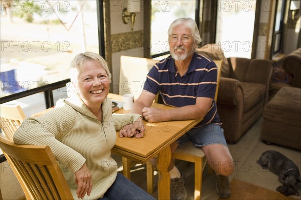 Senior Caucasian couple sitting in motor home