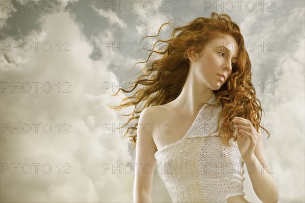 Caucasian woman's hair blowing in wind