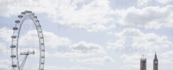 London Eye and clock towers in blue sky