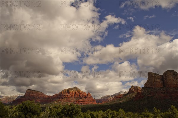 Clouds over rock formations in rural landscape