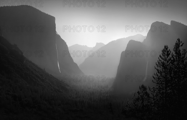 Rock formations in foggy landscape