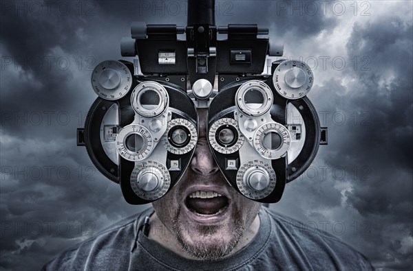Illustration of man looking through optometrist equipment