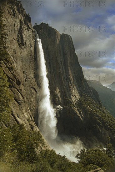 Waterfall over rock formations