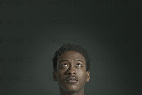 African American man looking up