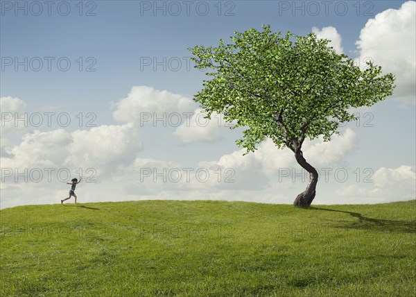 Girl running in rural landscape