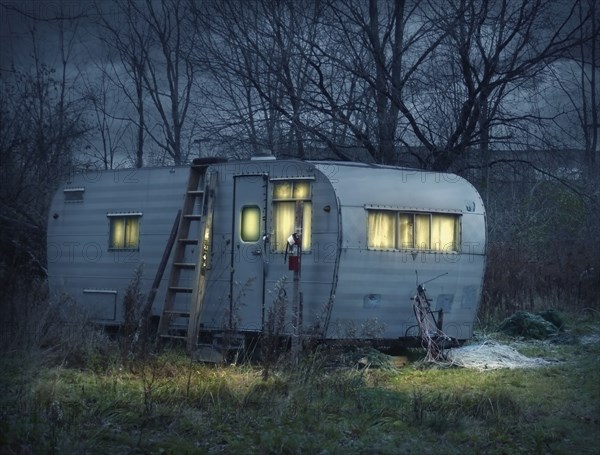 Glowing trailer in field