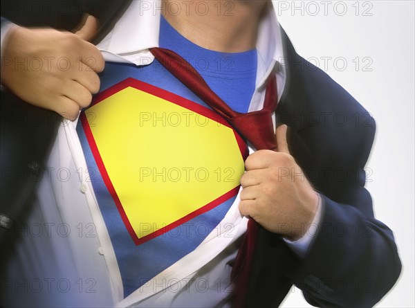 Businessman wearing superhero costume