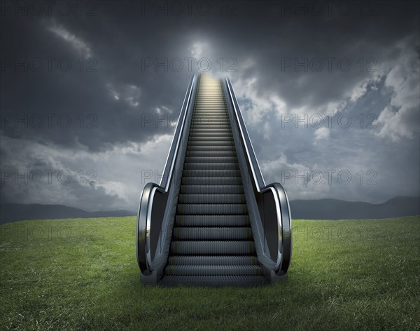 Escalator to cloudy sky in rural landscape