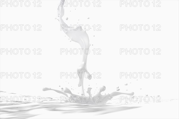Milk stream splashing into pool