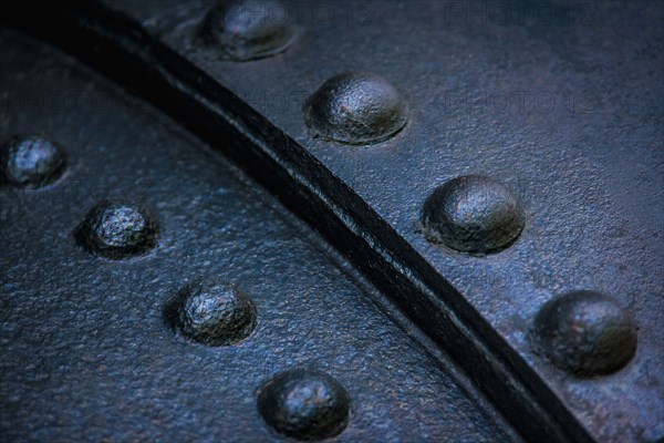 Close up of rivets on sheet metal