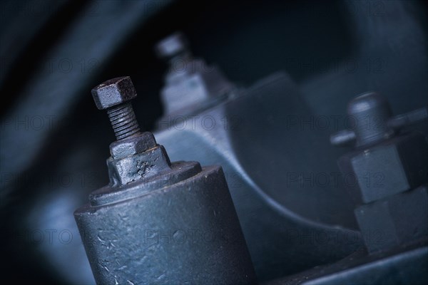 Close up of nuts and bolts on machinery