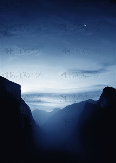 Illuminated mist and mountains