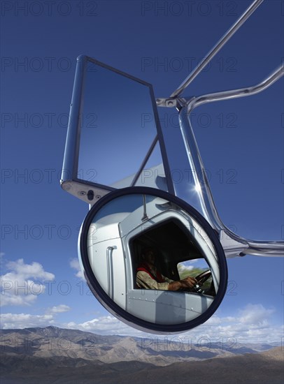 Trucker reflected in side mirror