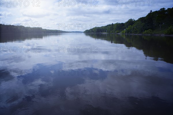 Clouds reflected in still lake