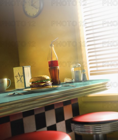 Burger and soda on diner counter