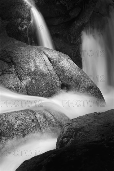 Water pouring over rock formations