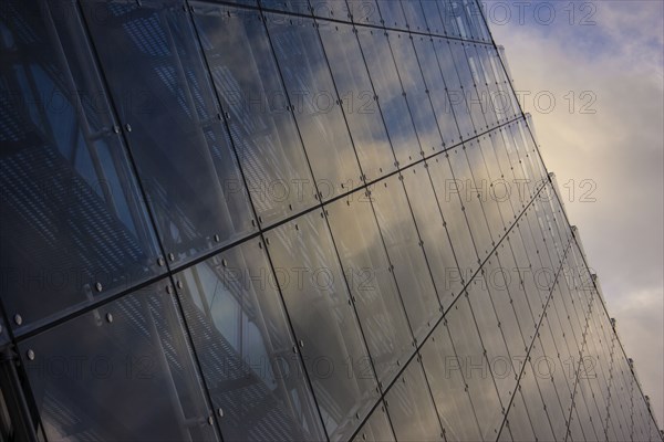 Close up of clouds reflected in windows of highrise