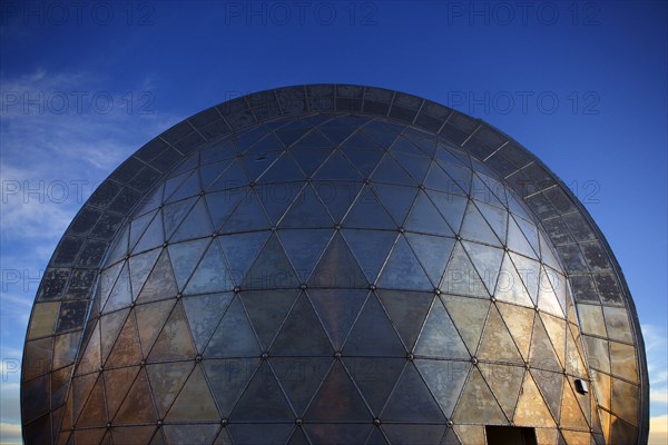 Metal observatory under blue sky