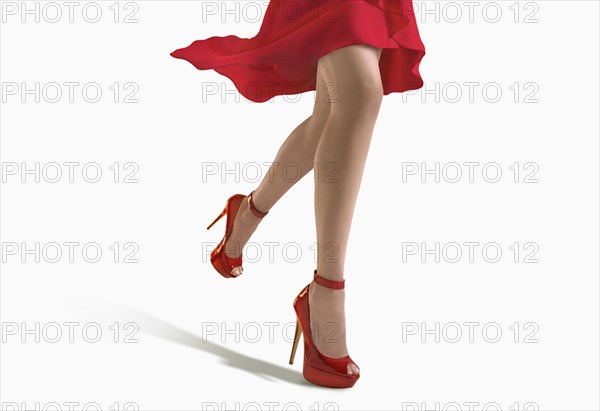 Woman wearing red dress and heels
