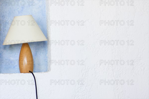 Close up of lamp in wall sconce