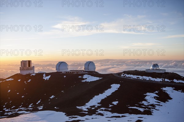 Observatory and silos on snowy mountaintop