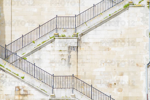 Banister and staircase on tall building