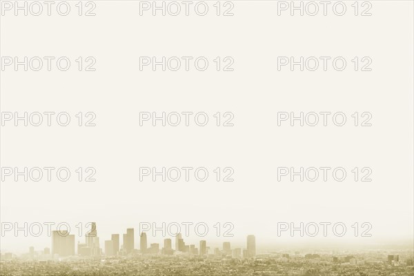 Silhouette of city skyline in hazy sky