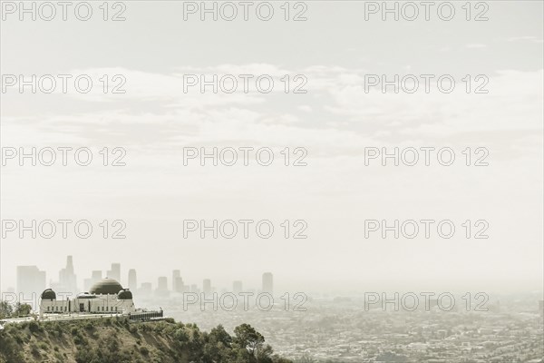 Observatory and city skyline in hazy sky