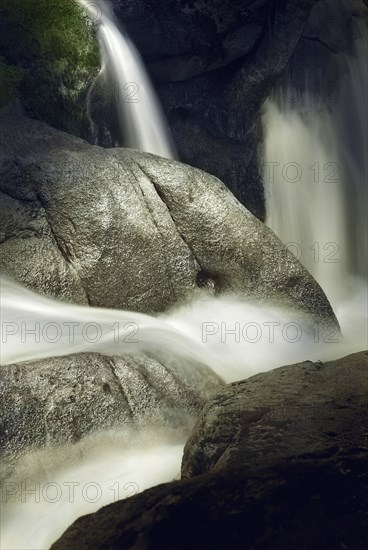 Time lapse view of waterfall over rocky cliff