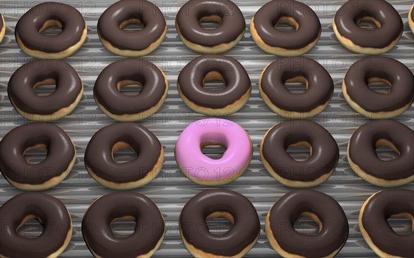 Close up of frosted donuts on baking pan