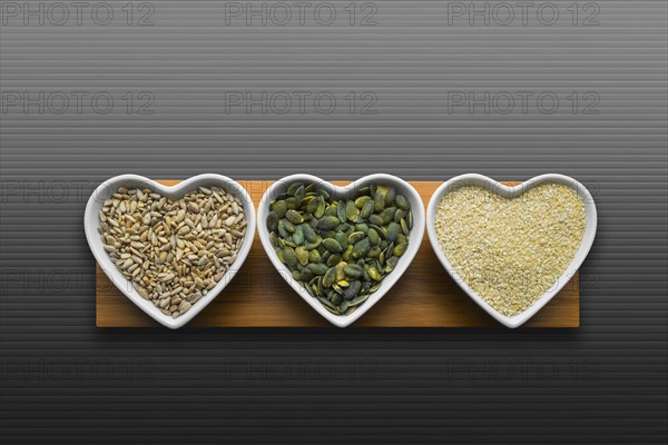 Heart-shaped bowls of heart-healthy seeds