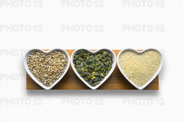 Heart-shaped bowls of heart-healthy seeds