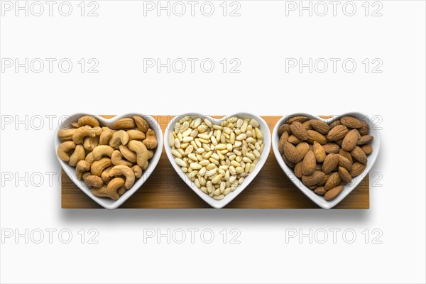 Heart-shaped bowls of heart-healthy nuts