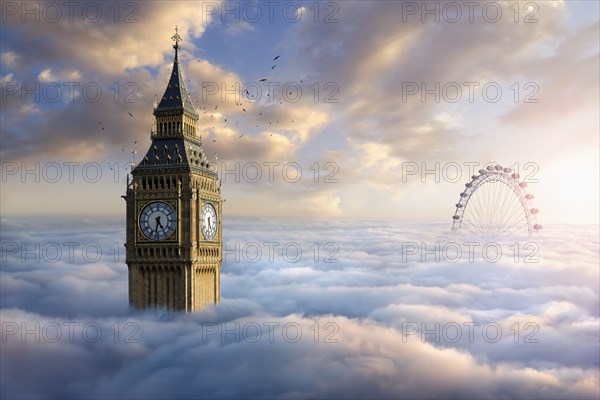 Birds flying around clock tower near ferris wheel above clouds