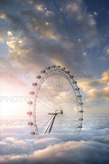 Ferris wheel above clouds