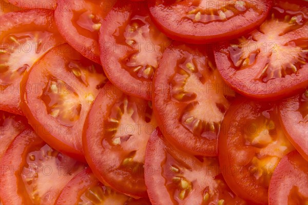 Pile of sliced red tomatoes