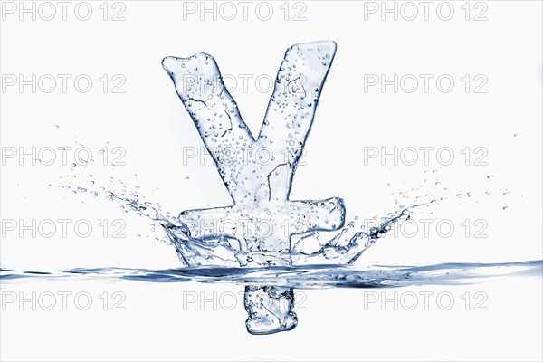 Water droplets splashing from sinking ice yuan symbol