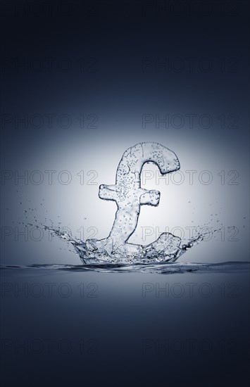 Water droplets splashing from ice British pound symbol
