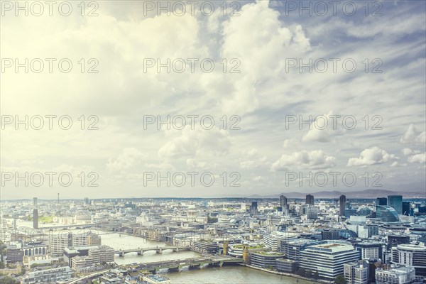 Clouds over river through city