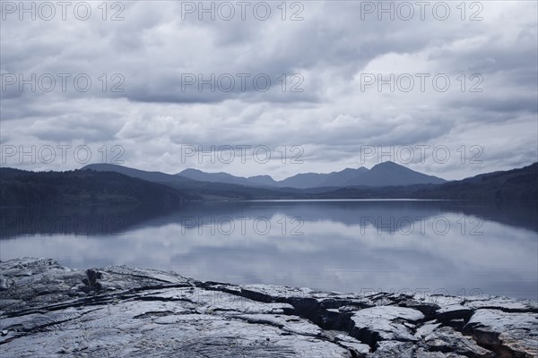 Reflection of clouds in mountain lake