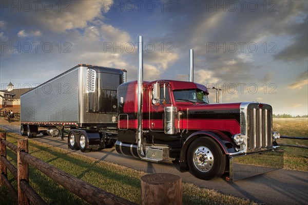 Semi-truck driving on rural road