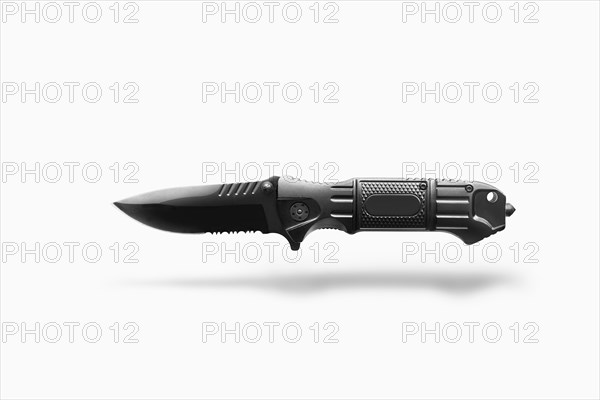 Switchblade floating on white background