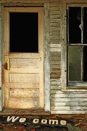 Dilapidated door and broken window