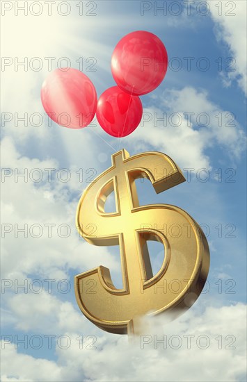 Red balloons lifting dollar symbol in cloudy sky