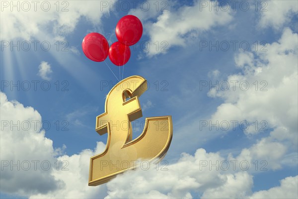 Red balloons lifting British pound symbol in cloudy sky