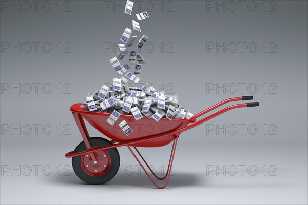 British pounds falling into red wheelbarrow